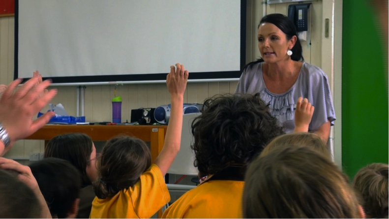 students having a reflective discussion with teacher