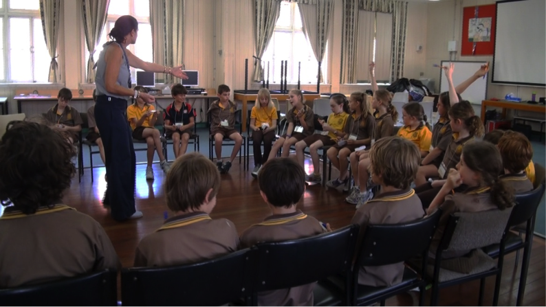 example of how adults sit on chairs in a studio conference